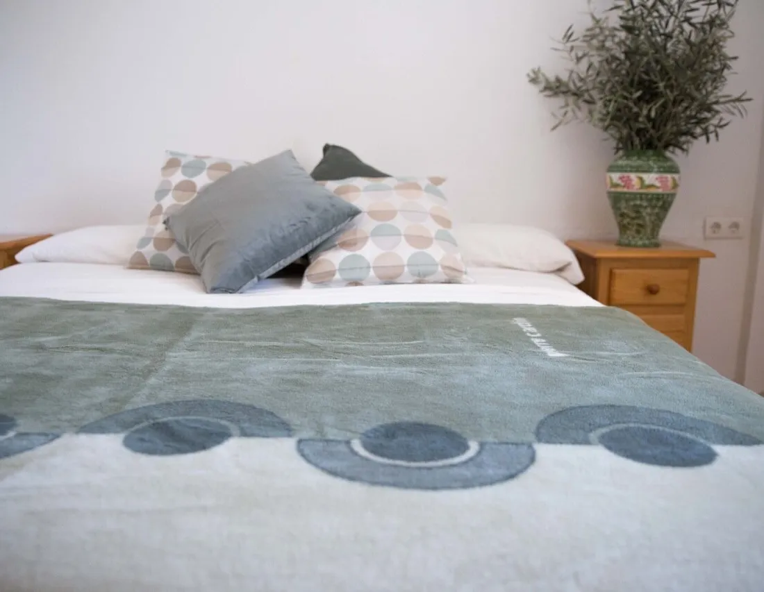 Double bed, green/grey bedding